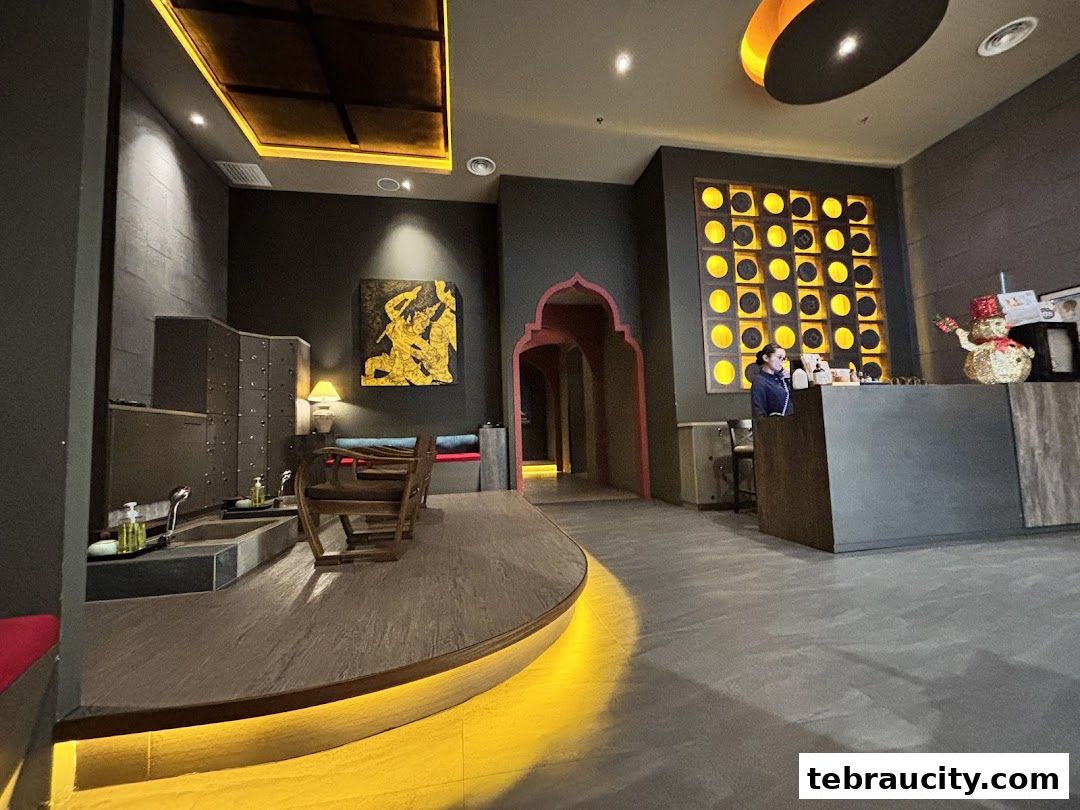 Interior of a spa with a reception area, lockers, and foot spa stations.