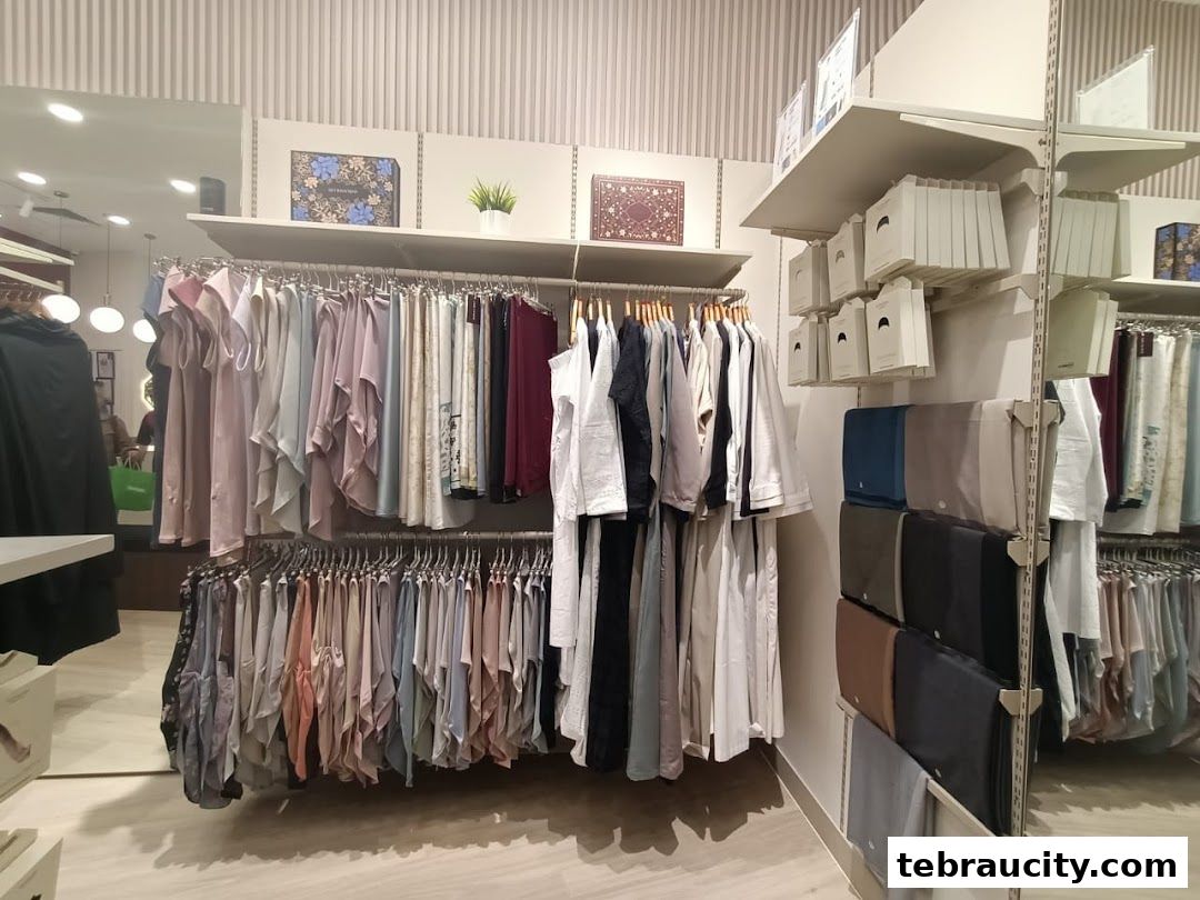A well-lit retail store interior showcasing a wide selection of modest fashion apparel.