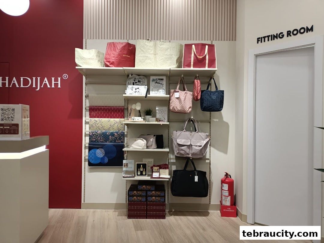 Siti Khadijah store interior showcasing bags, fabrics, and a fitting room.
