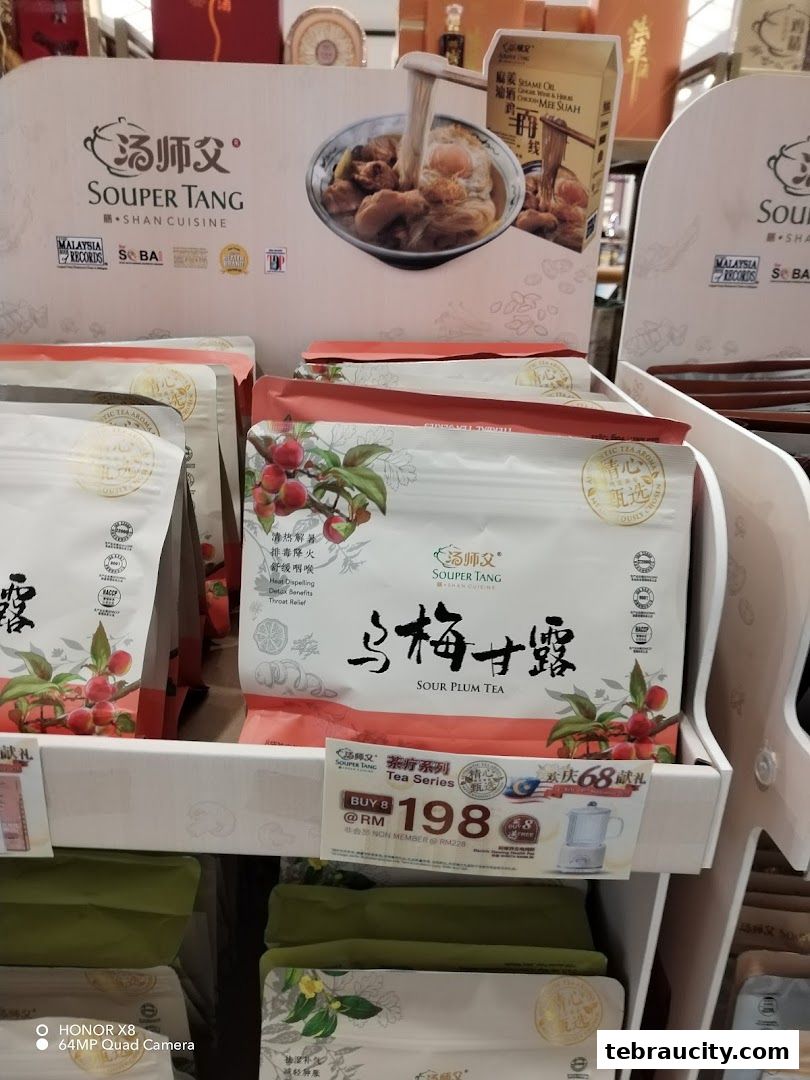 A display of Souper Tang Sour Plum Tea and other products with promotional signage.