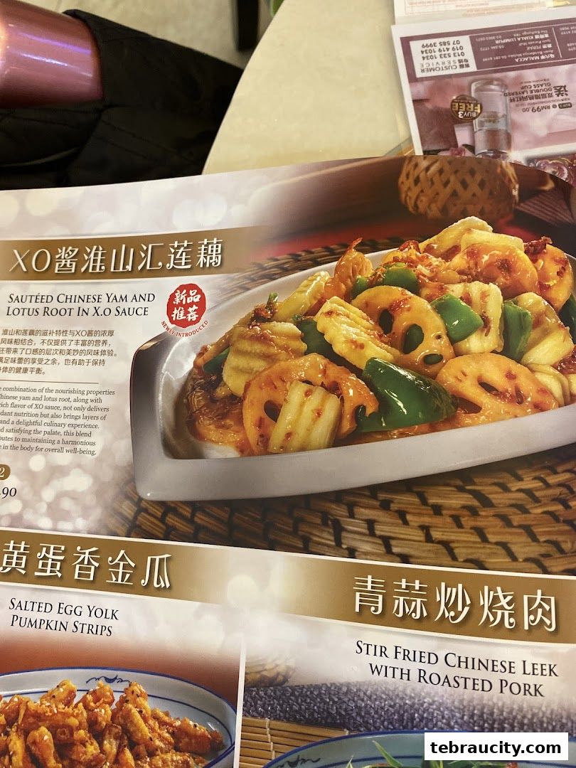 A menu featuring Chinese dishes, including XO sauce yam and lotus root, and salted egg yolk pumpkin strips.