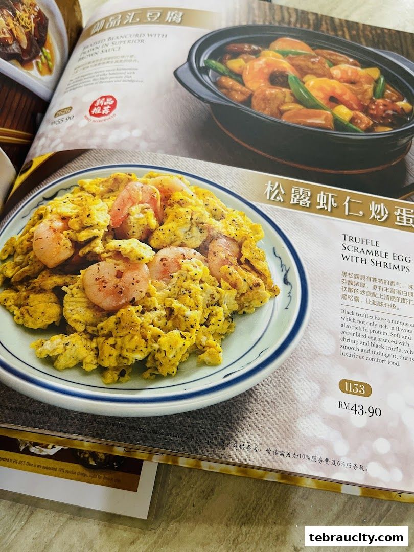 A menu page from Souper Tang featuring truffle scrambled egg with shrimps and braised beancurd.