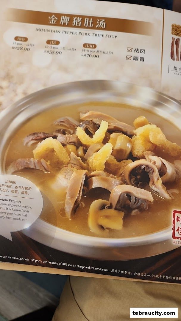 A close-up of a bowl of Mountain Pepper Pork Tripe Soup with menu details.
