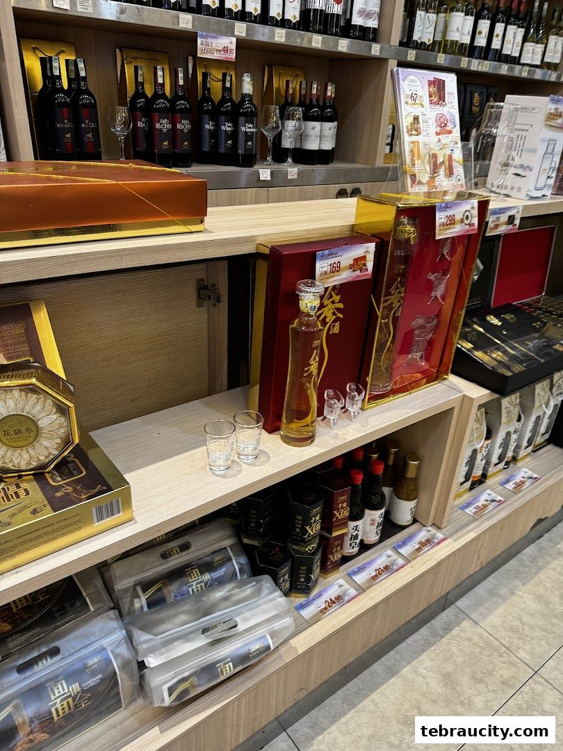 A retail display featuring various bottles of wine, spirits, and packaged food items.