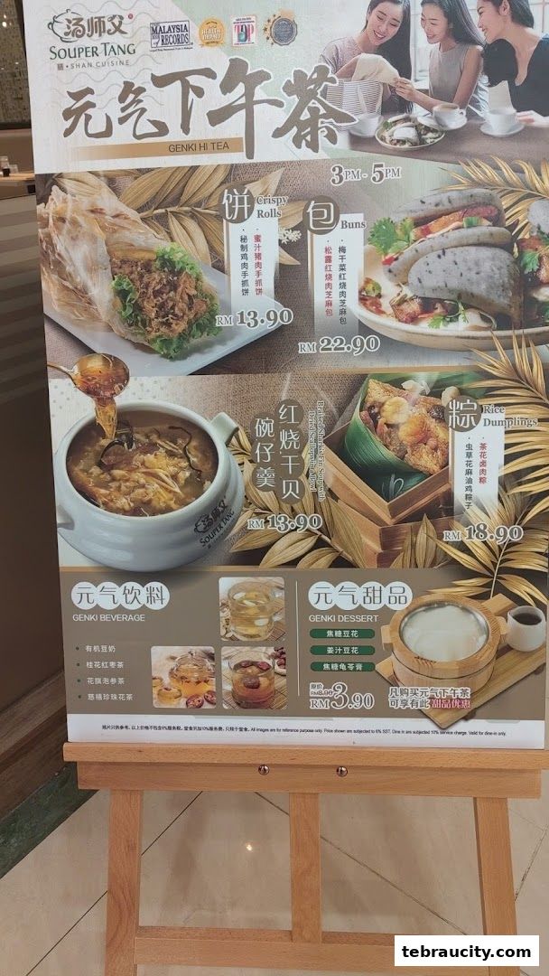 A menu board for Souper Tang's Genki Hi Tea promotion, featuring various dishes and drinks.