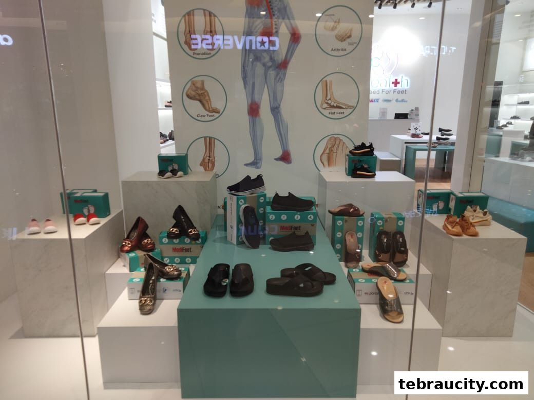 A shop window display featuring a variety of comfortable footwear for different foot conditions.