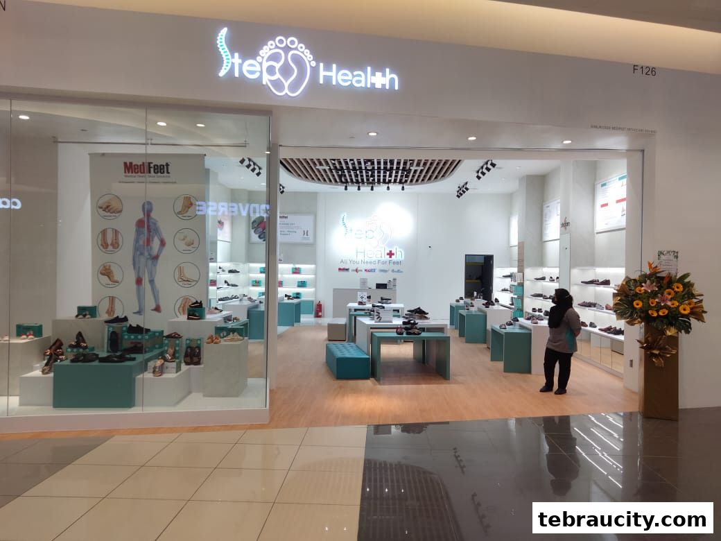 The entrance and interior of a Step Health Medifeet shoe store, showcasing footwear and health-related displays.