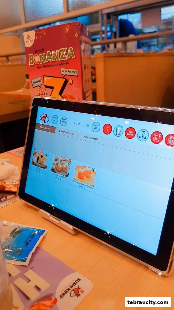 A tablet displays a menu at Sushi King, with a Bonanza promotion box in the background.