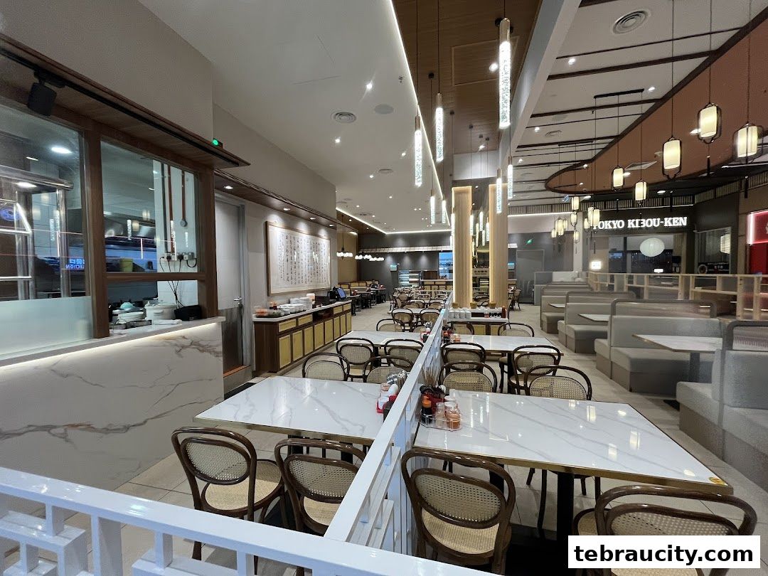 Interior view of a clean and modern restaurant with tables and seating.