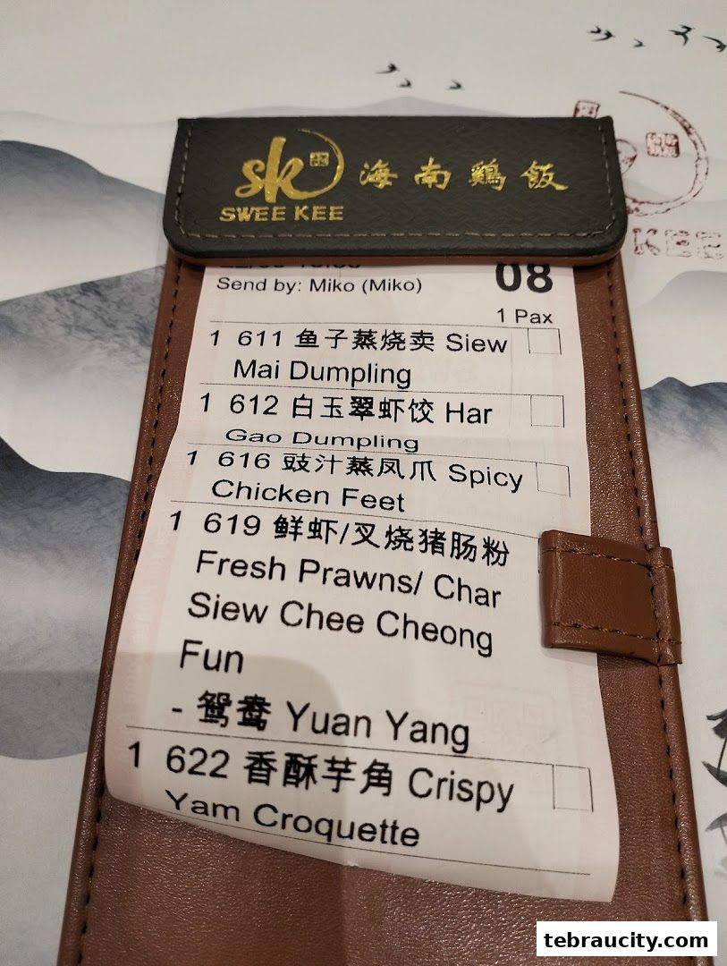 A receipt from Swee Kee Chicken Rice listing various dim sum items and their descriptions.