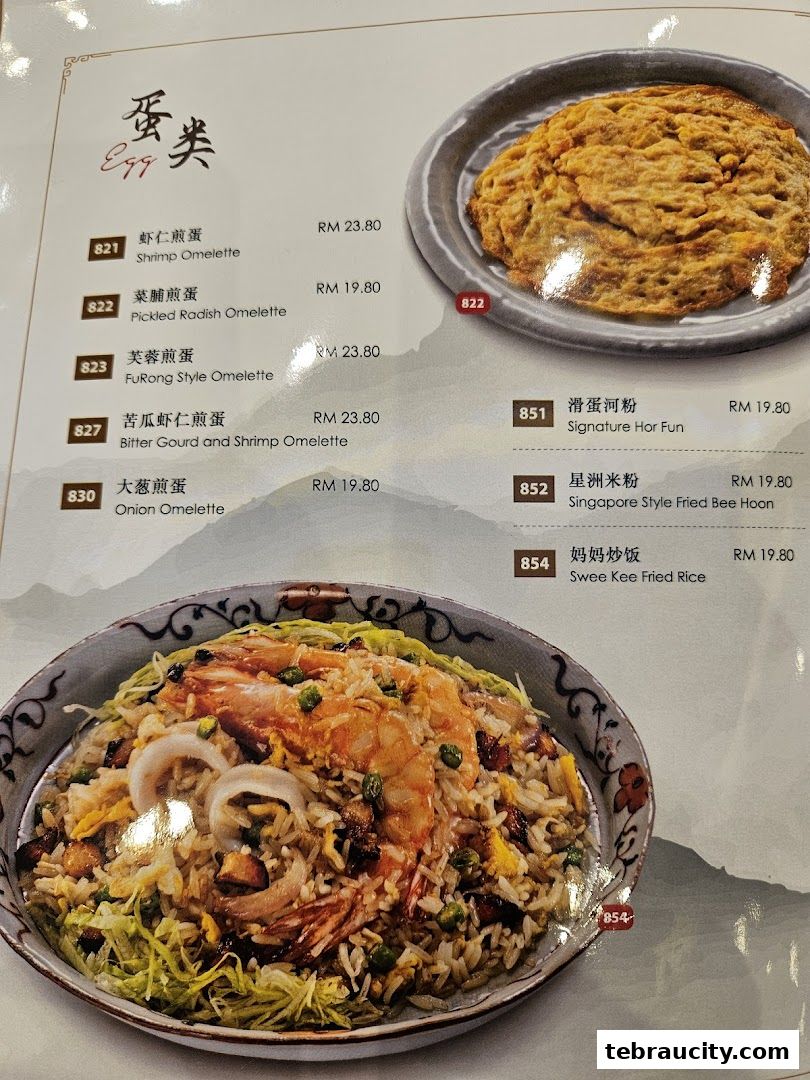 A menu featuring various omelettes, hor fun, and fried rice dishes with prices.