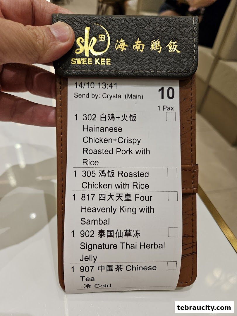 A receipt from Swee Kee Chicken Rice showing various food and drink orders.