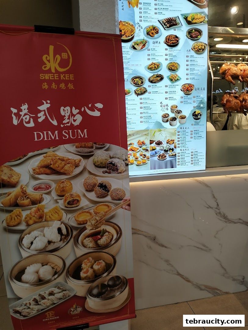 A red banner advertises Dim Sum next to a menu board displaying various dishes and roasted chickens.