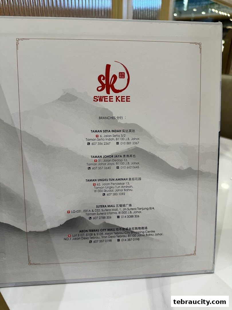 A list of branches for Swee Kee Chicken Rice, including addresses and contact numbers.