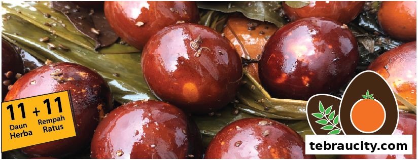Close-up of glossy, brown-marinated eggs with herbs and spices, presented on banana leaves.