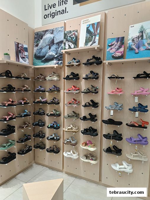 Interior view of a Teva store showcasing a wide variety of sandals on display.