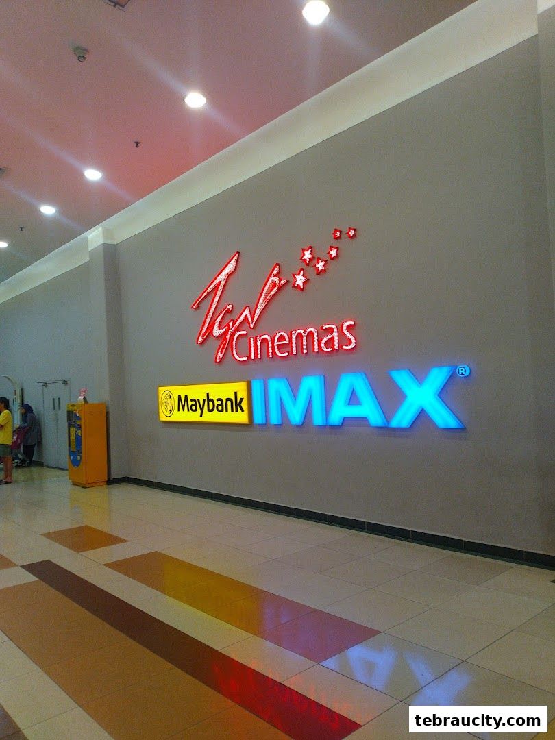 The TGV Cinemas IMAX entrance with illuminated signage and a Maybank advertisement.