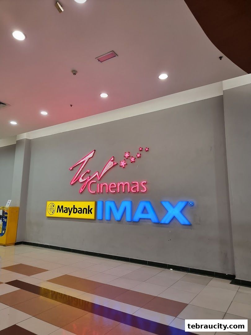 The TGV Cinemas IMAX logo is displayed prominently on a grey wall with neon lighting.
