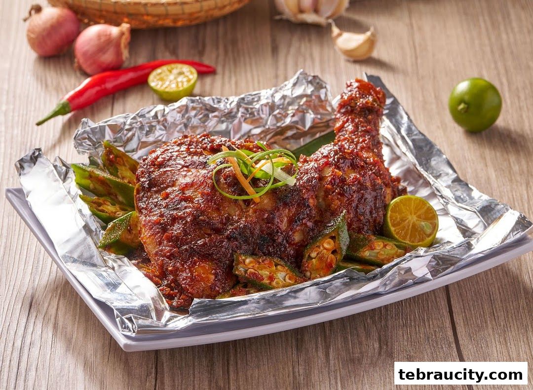 A delicious plate of roasted chicken with okra and lime, garnished with spring onions.
