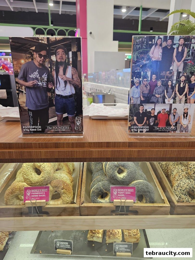 Display case filled with various bagels and cinnamon rolls at The Founders Bakery.