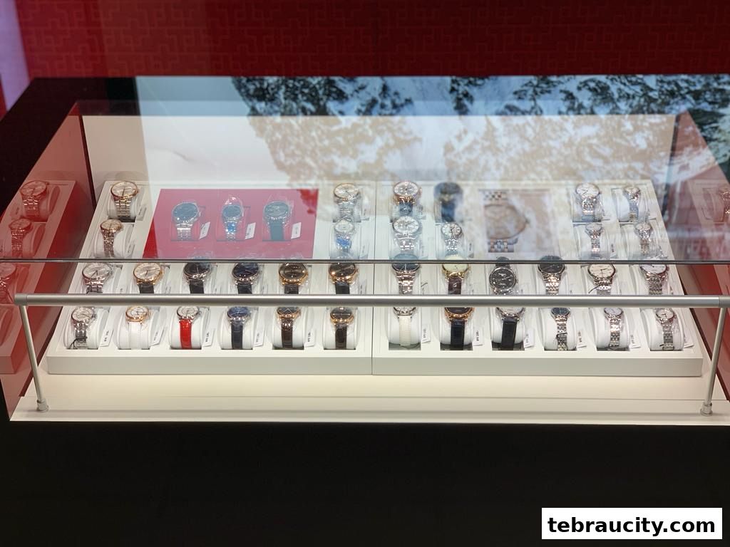 A display case filled with various Tissot watches, showcasing different styles and colors.
