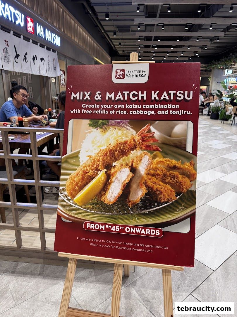 A sign advertising 'Mix & Match Katsu' with a picture of fried food at Tonkatsu by Ma Maison.