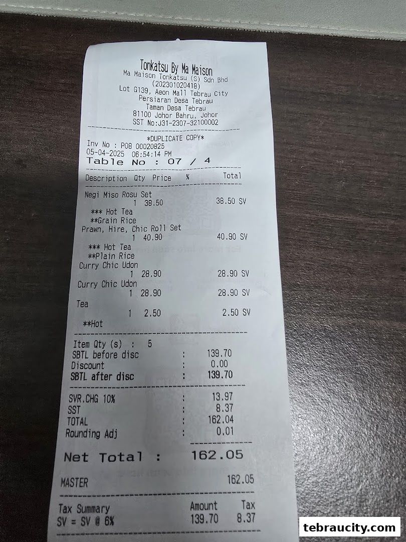 A receipt from Tonkatsu by Ma Maison showing food items and their prices.
