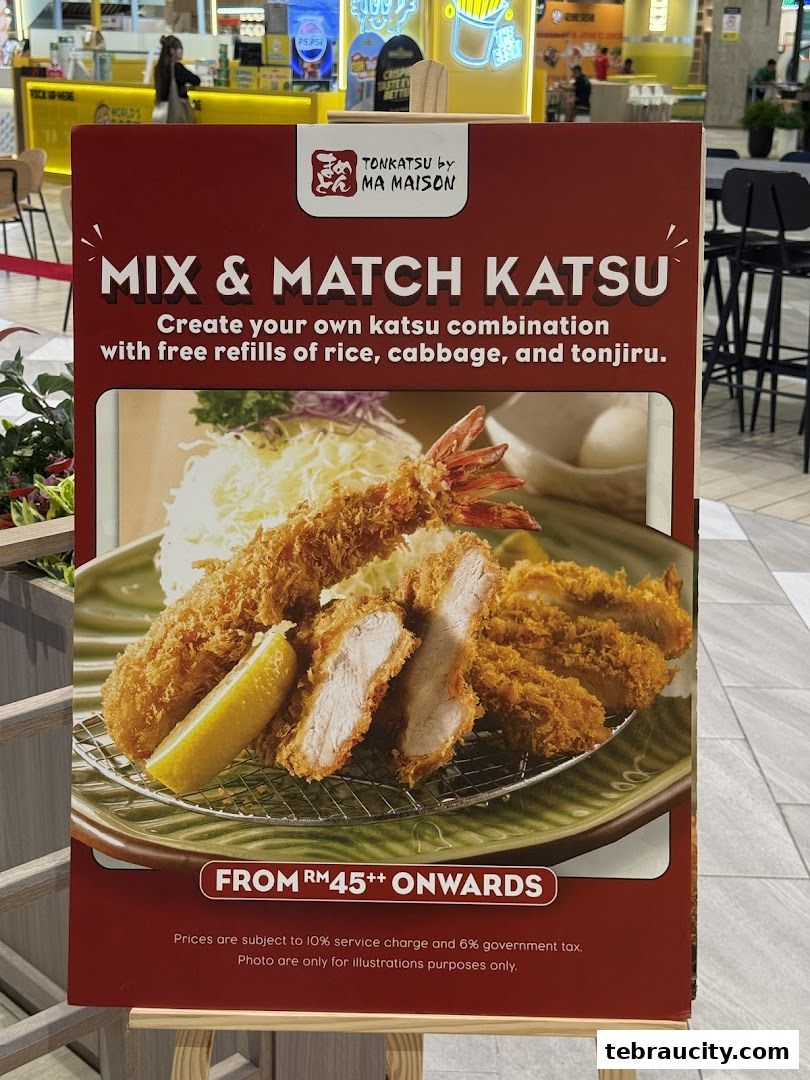 A sign advertising Tonkatsu by Ma Maison's 'Mix & Match Katsu' with a picture of the dish.