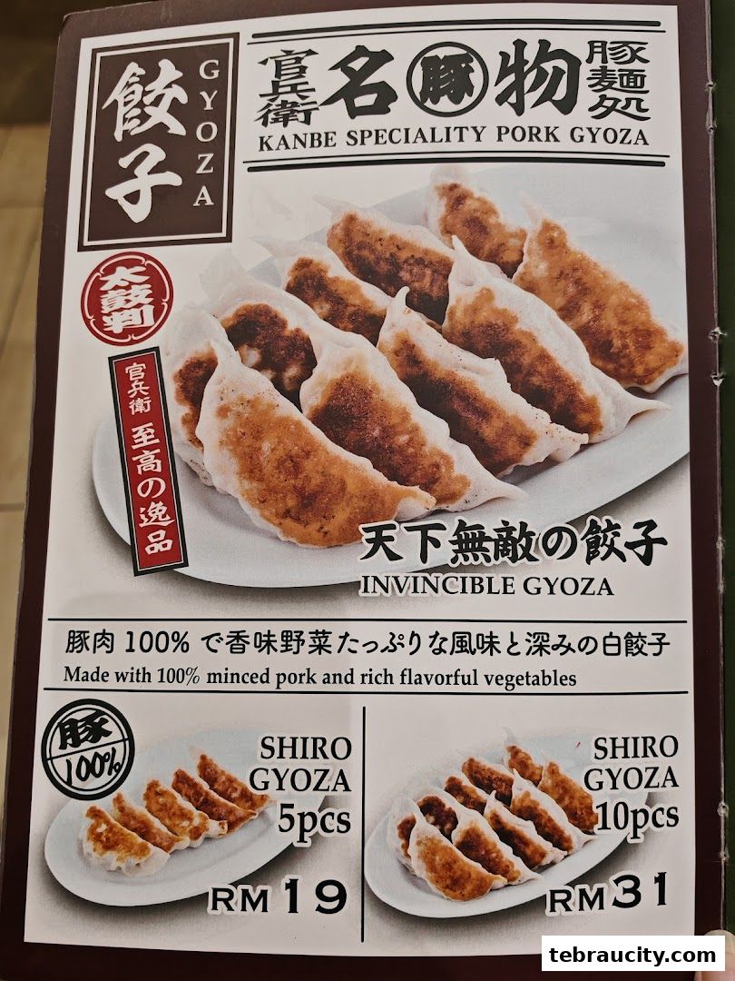 A menu featuring Kanbe speciality pork gyoza with prices for 5 and 10 pieces.