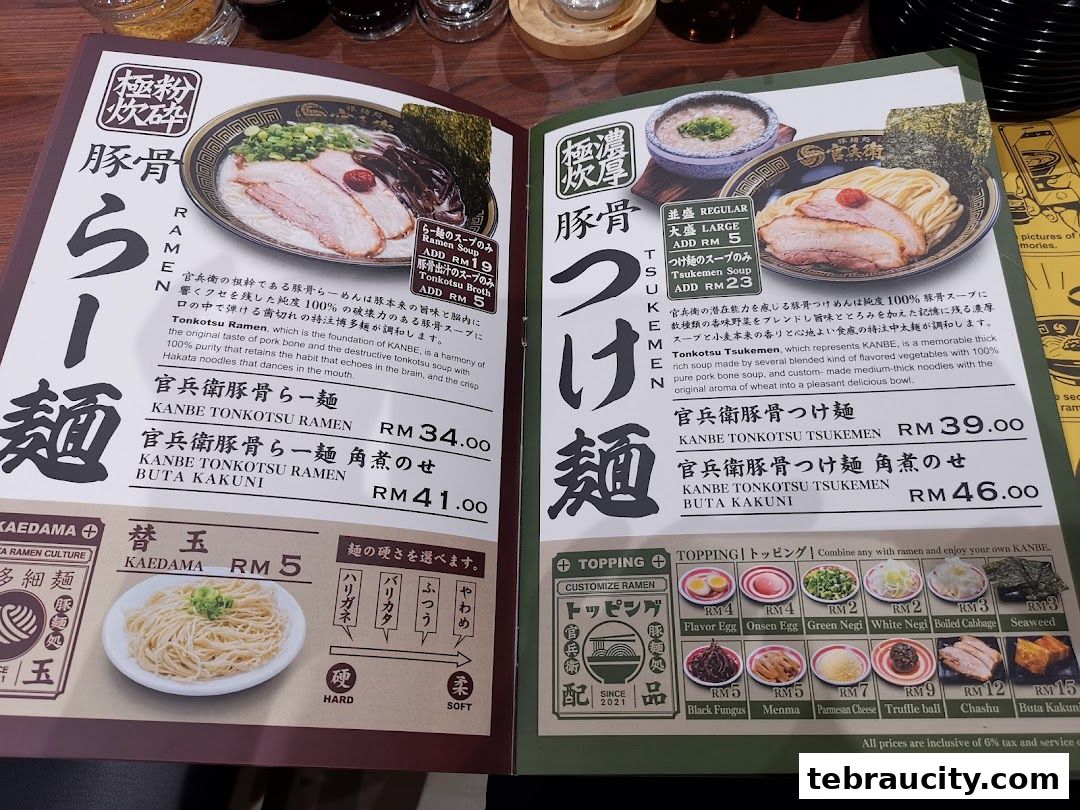 A menu featuring various ramen and tsukemen dishes with prices and toppings.
