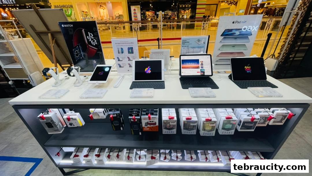 Display of Apple products including iPads, Apple Watch, and accessories in a retail store.