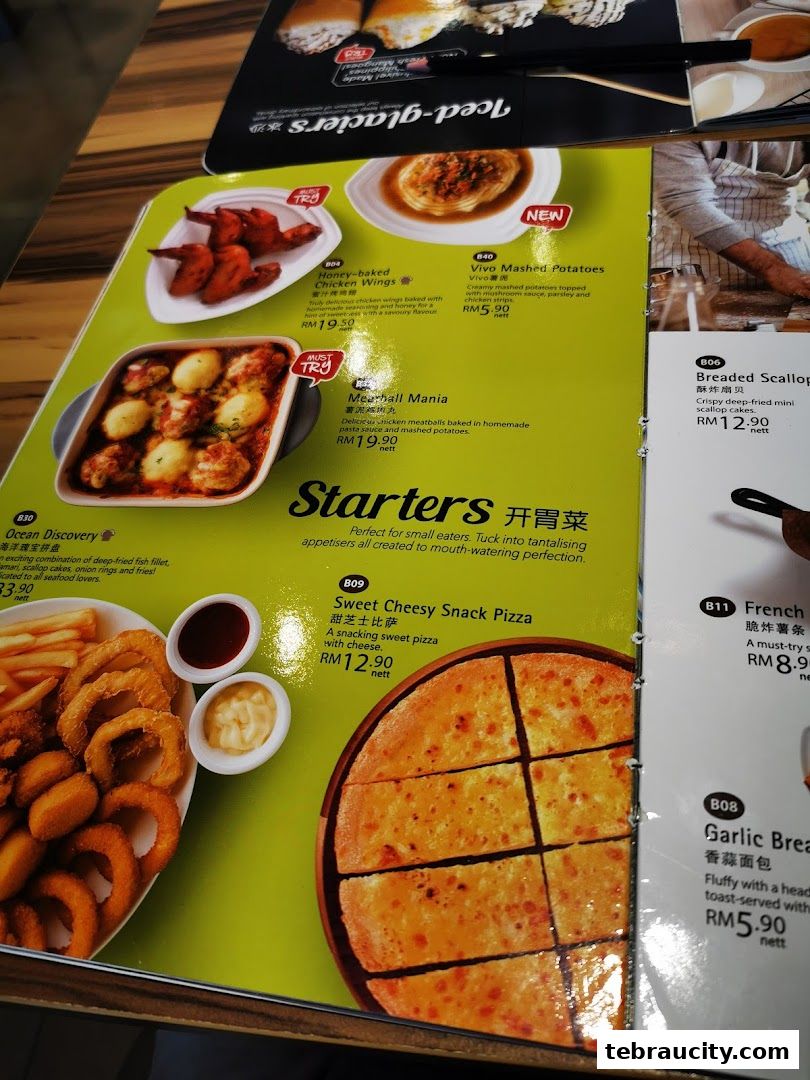 A menu from Vivo Pizza featuring starters like honey-baked chicken wings and sweet cheesy snack pizza.