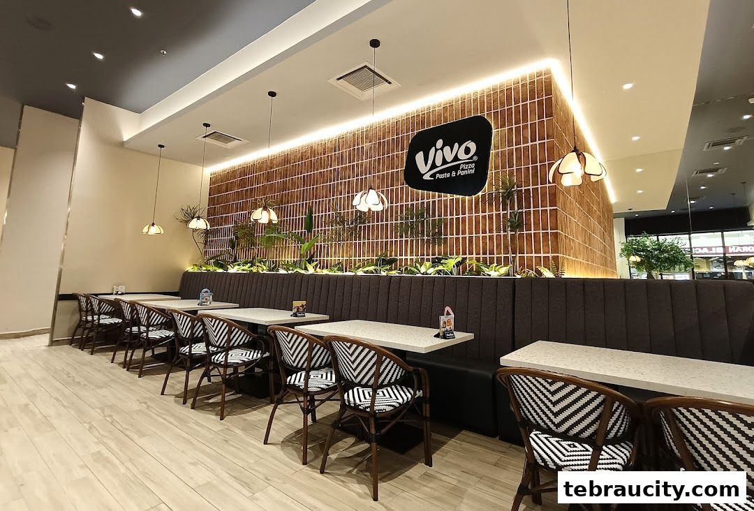 Interior view of Vivo Pizza Pasta & Panini restaurant with seating and decor.