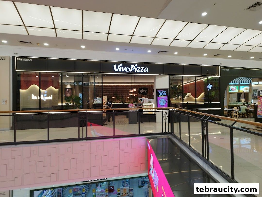 The Vivo Pizza restaurant storefront with its modern signage and interior visible through the glass.