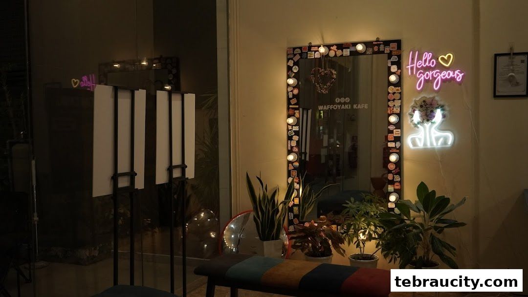 A cafe interior with neon signs, plants, and a mirror.