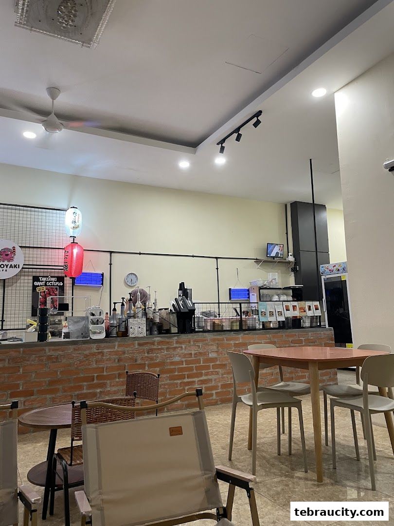 Interior view of Waffoyaki Kafe with seating, counter, and decor.