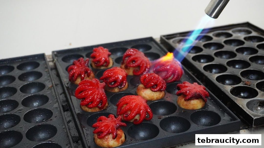 A close-up of baby octopuses being torched on a griddle at Waffoyaki Kafe.