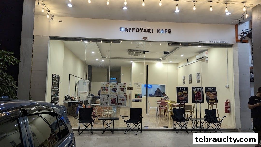 The exterior of Waffoyaki Kafe with a large glass storefront and outdoor seating.