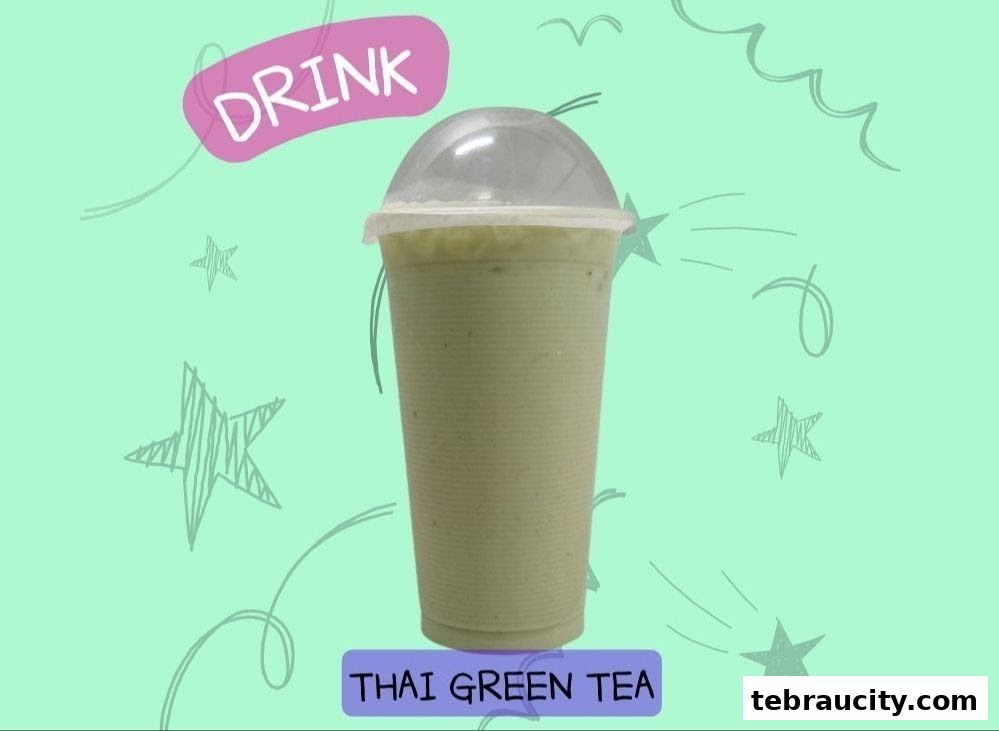 A refreshing Thai Green Tea drink in a clear plastic cup with a dome lid.