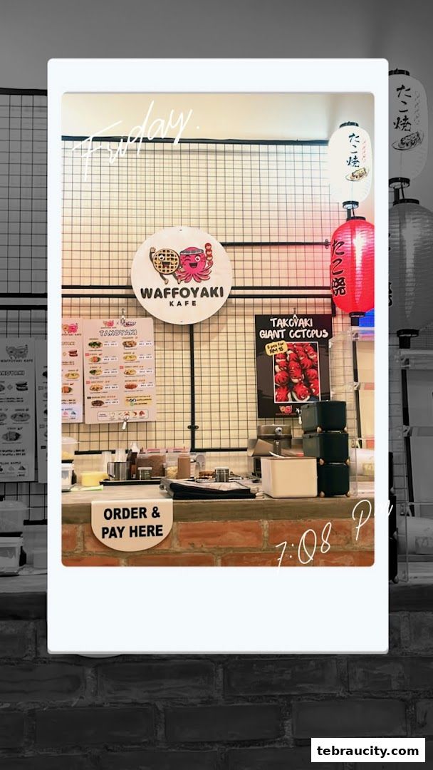 The counter area of Waffoyaki Kafe with a menu, lanterns, and an 'Order & Pay Here' sign.