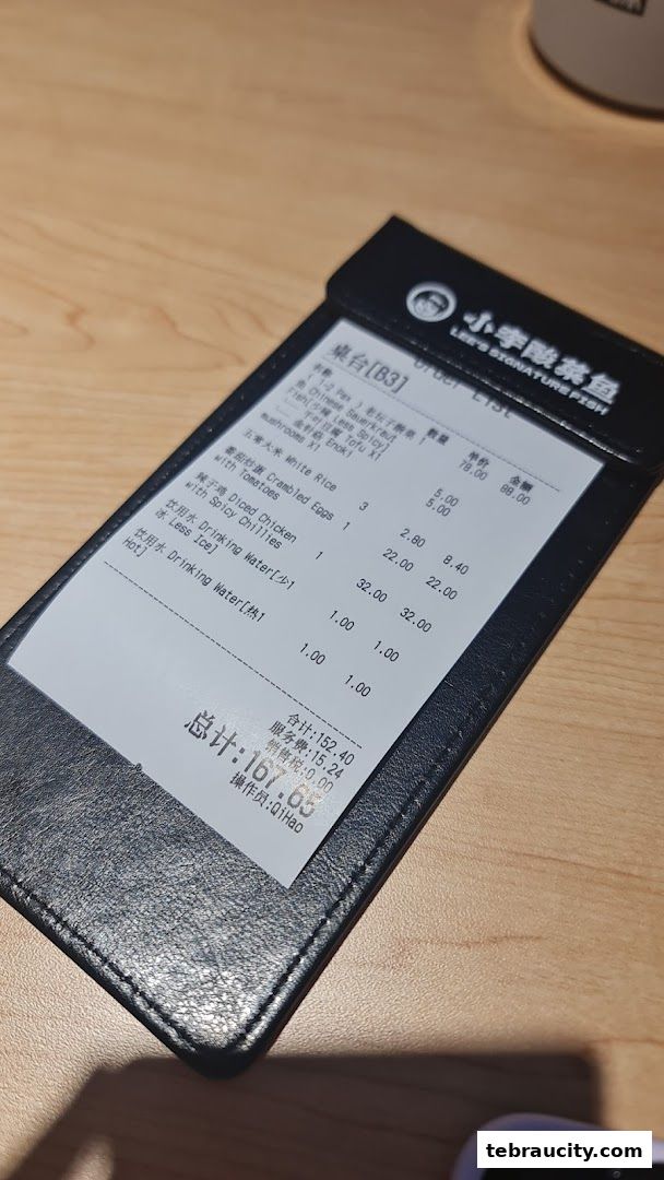 A receipt from Lee's Signature Fish showing ordered items and total cost.