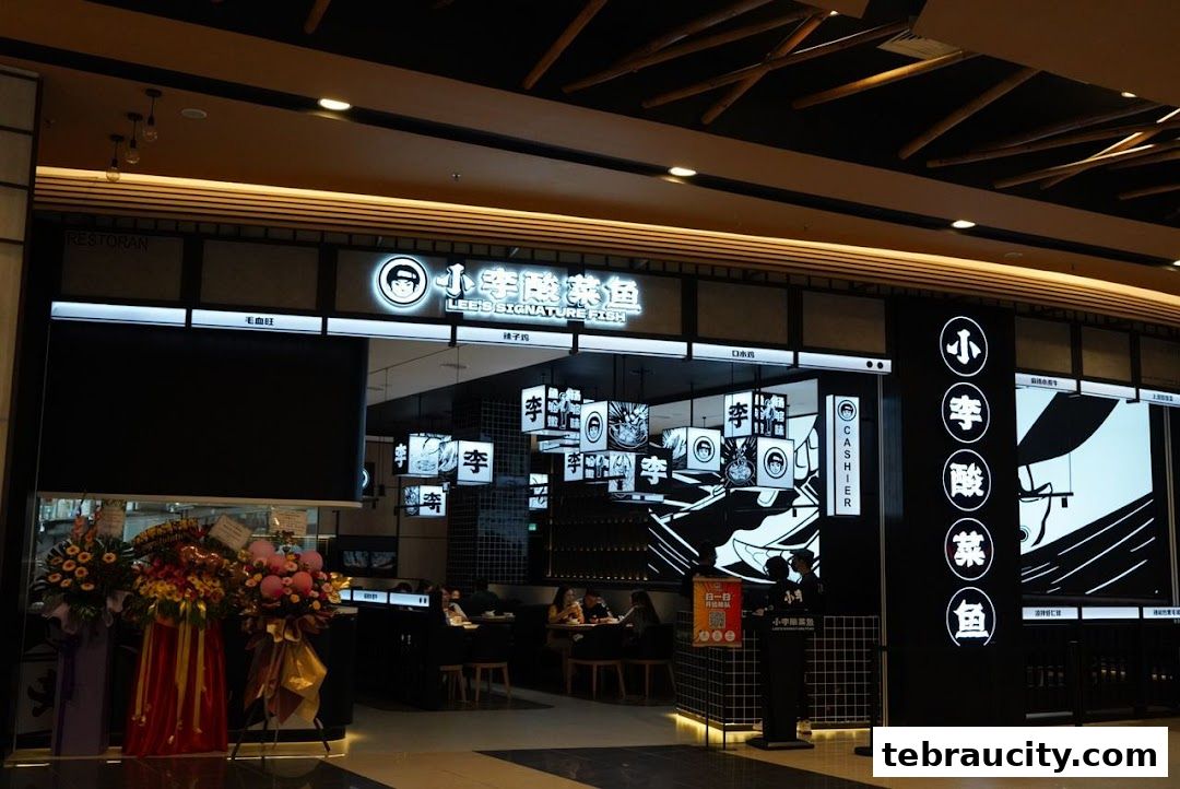 The exterior of Lee's Signature Fish restaurant with its distinctive black and white signage and interior seating visible.