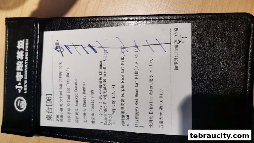A menu from Lee's Signature Fish with various dishes and drinks listed.