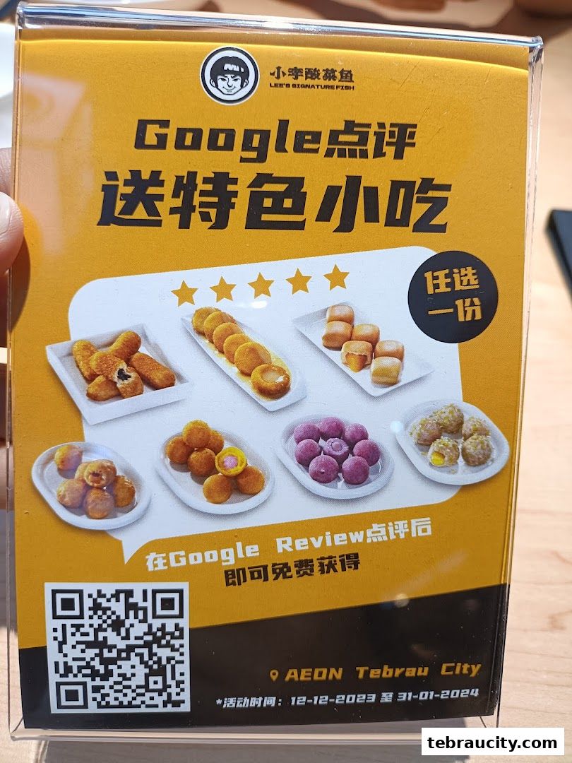 A promotional sign for Lee's Signature Fish offering a free snack with a Google review.