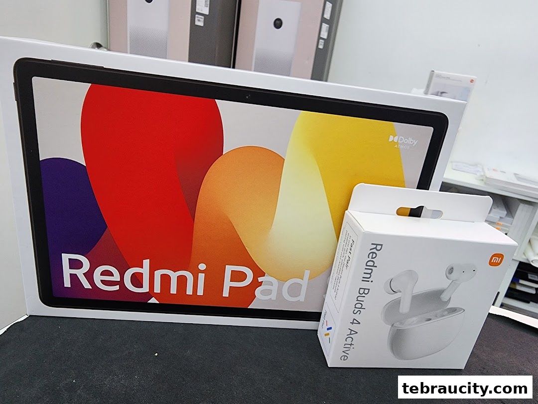Xiaomi Redmi Pad and Redmi Buds 4 Active packaging displayed in a store.