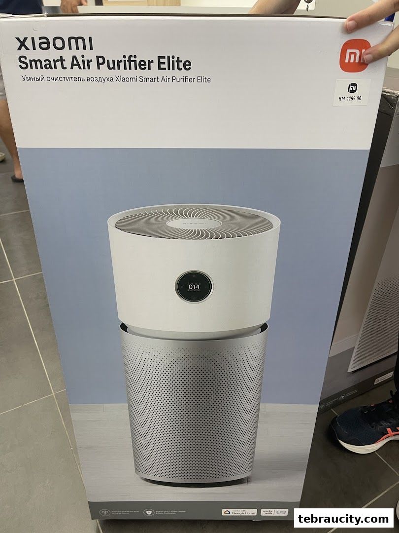 A Xiaomi Smart Air Purifier Elite is displayed in its packaging, showing the product and price.