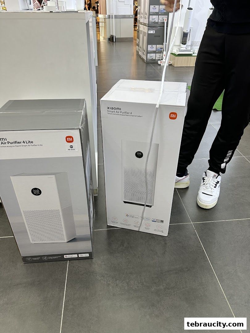 Two Xiaomi air purifiers, one Lite model and one Smart Air Purifier 4, are displayed in their boxes.