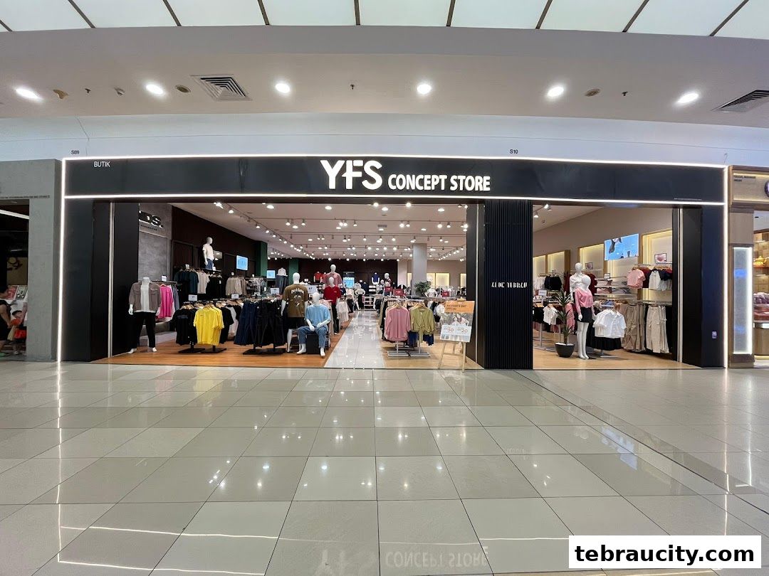 The entrance of YFS Concept Store, showcasing a variety of clothing on mannequins and racks.