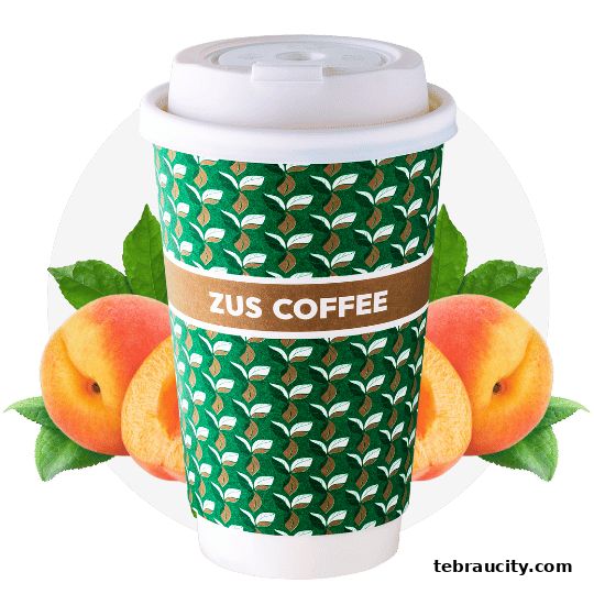 A ZUS Coffee cup with a peach and leaves, featuring a green patterned design.