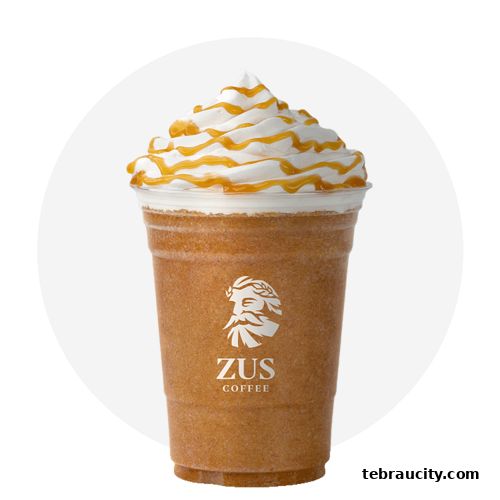 A caramel iced coffee drink with whipped cream and caramel drizzle from ZUS Coffee.